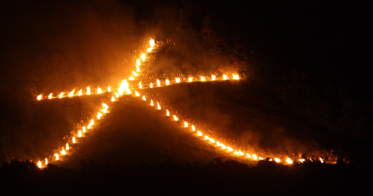 The giant burning character of the Daimonji send-off fire, its rows of fire beds picked out against the black hillside of Mount Nyoigatake above Kyoto