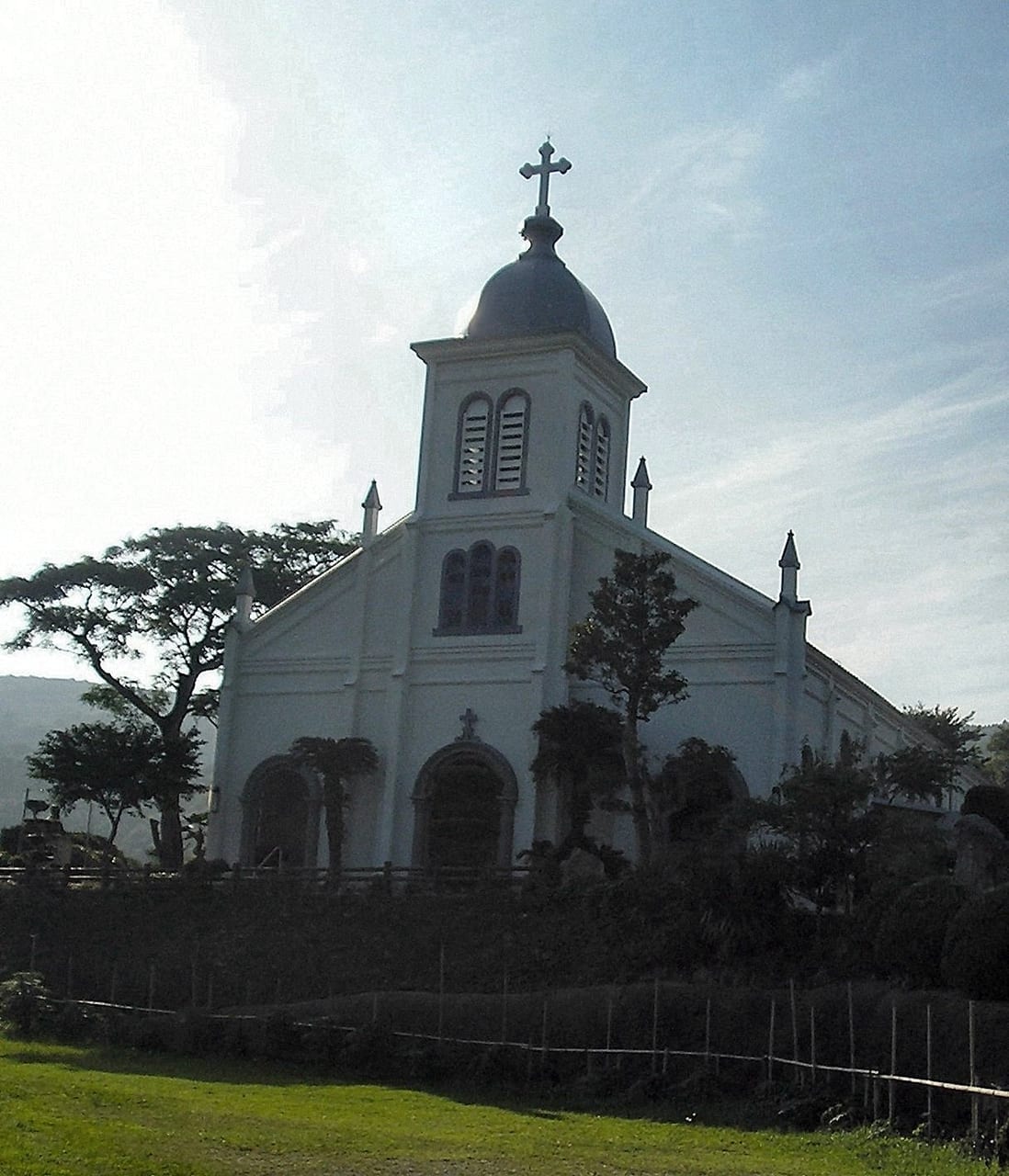 The white Romanesque Oe Church standing on a hill in the western lower island of Amakusa
