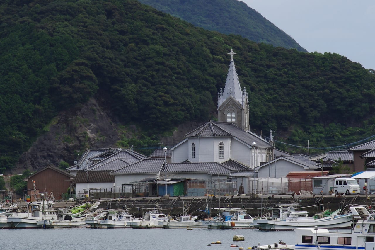 The seaside streetscape of the Sakitsu fishing village on the lower Amakusa island with moored boats