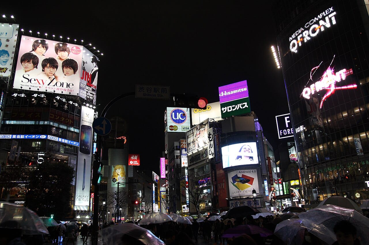 The signage and crowds at Shibuya Crossing in Tokyo — the kind of scene where a maps app earns its keep in Japan