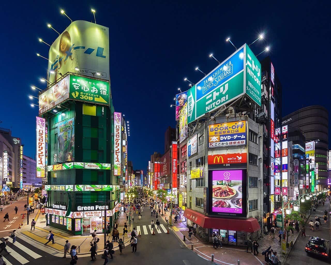 Neon street signs at dusk in Shinjuku, Tokyo — a reminder that you don't need dozens of apps for Japan, just a solid few