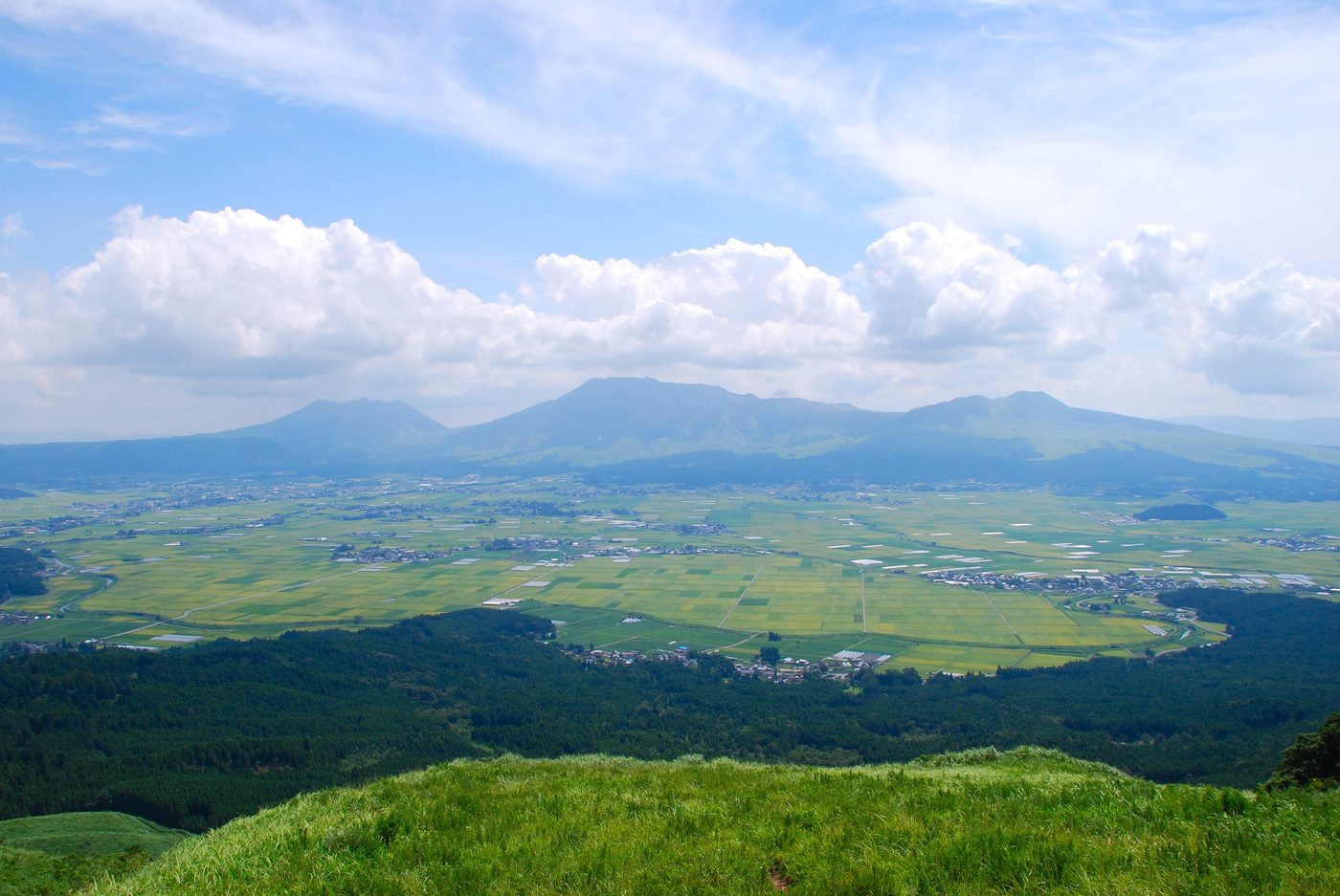 View over the Aso caldera from the northern outer rim near Daikanbo, with the five peaks and patchwork farmland