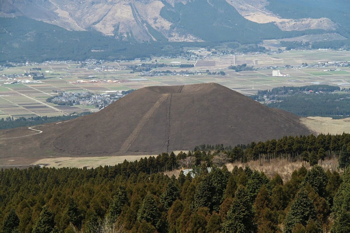 Komezuka, the grass-covered miniature volcanic cone at Mt. Aso, with its dimpled summit