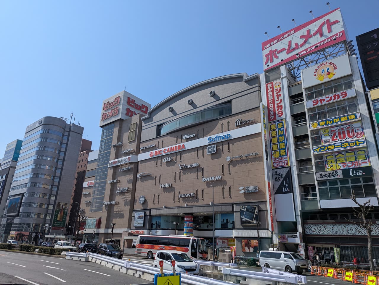 The red sign and storefront of a Bic Camera electronics store