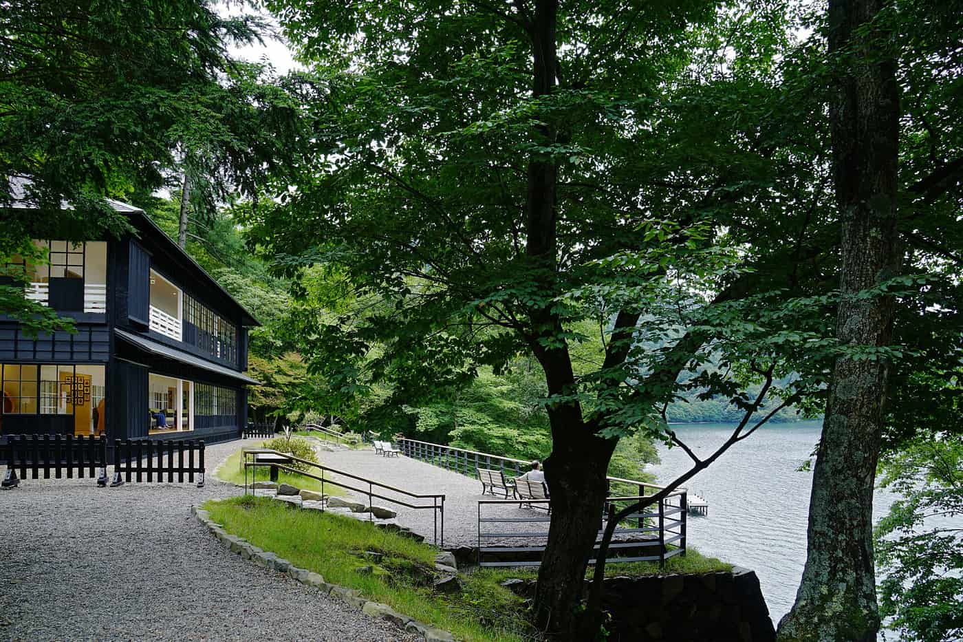 The dark clapboard British Embassy Villa with its gravel lakeside terrace facing Lake Chuzenji