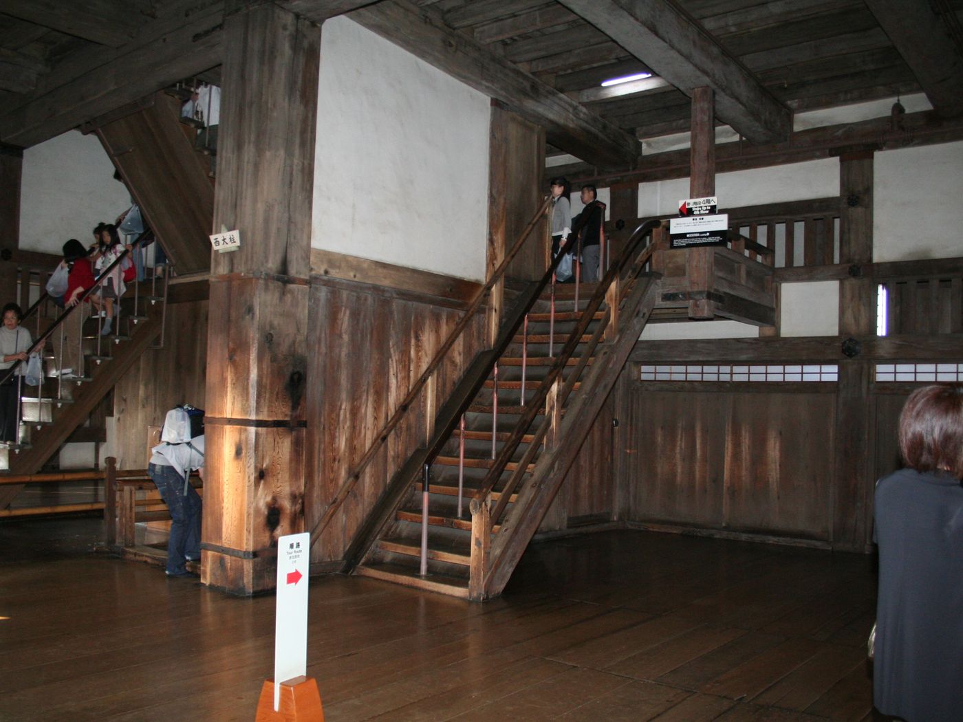 Steep narrow wooden stairs inside the main keep of Himeji Castle