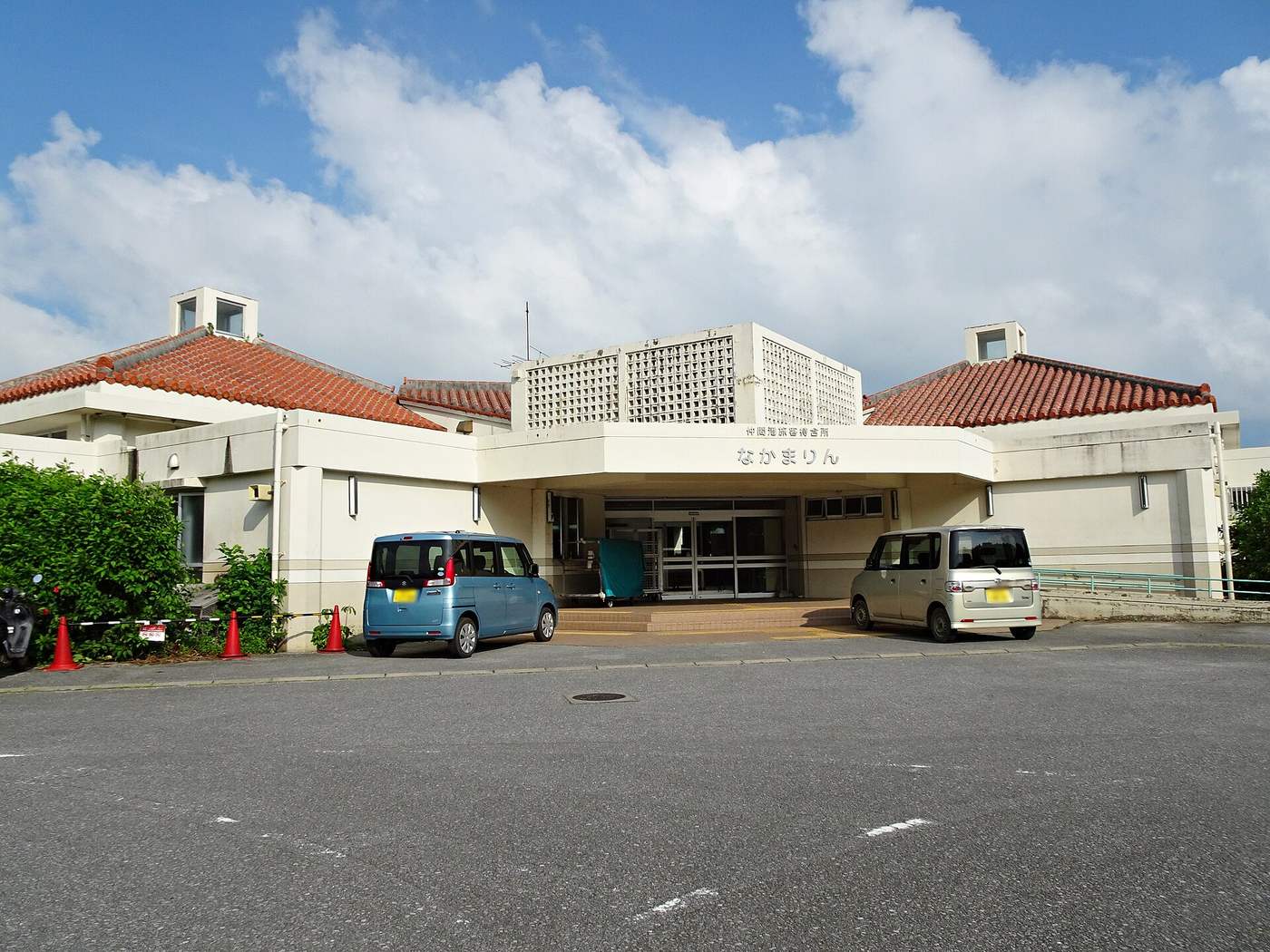 Nakamarin, the passenger waiting hall at Ohara Port on Iriomote, a low red-tiled building facing its car park