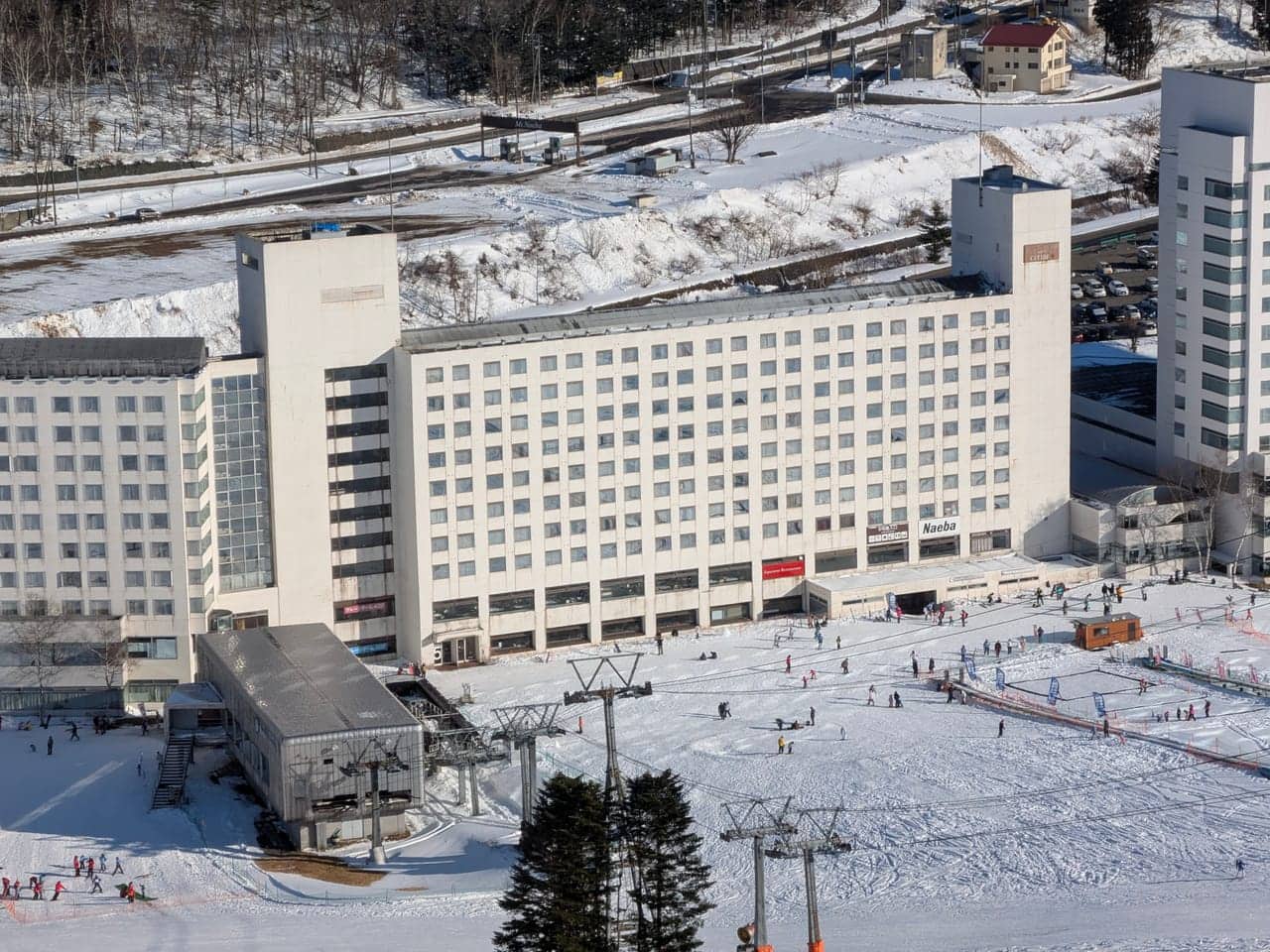 Ski slope at Naeba in Japan; skiing is often a specified activity needing separate confirmation of cover