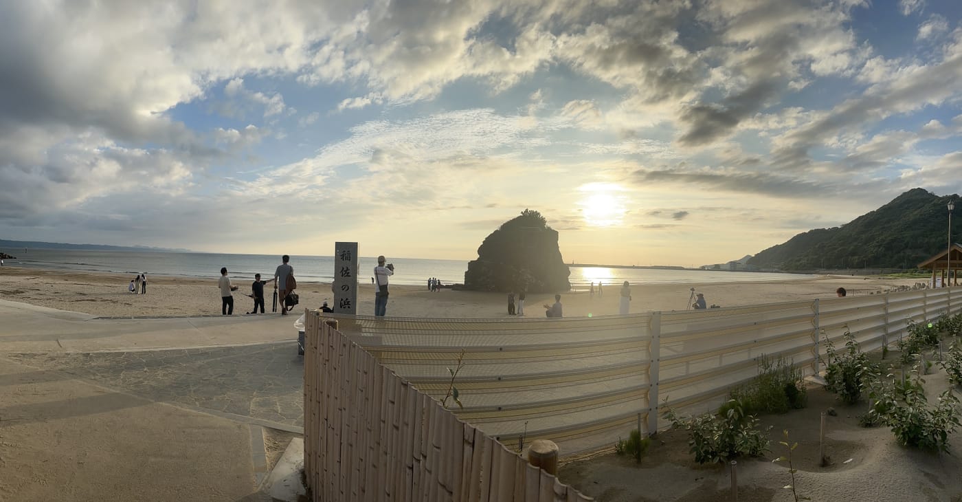 Inasa Beach and the Bentenjima islet at dusk, the site of the Kamimukae welcoming ritual