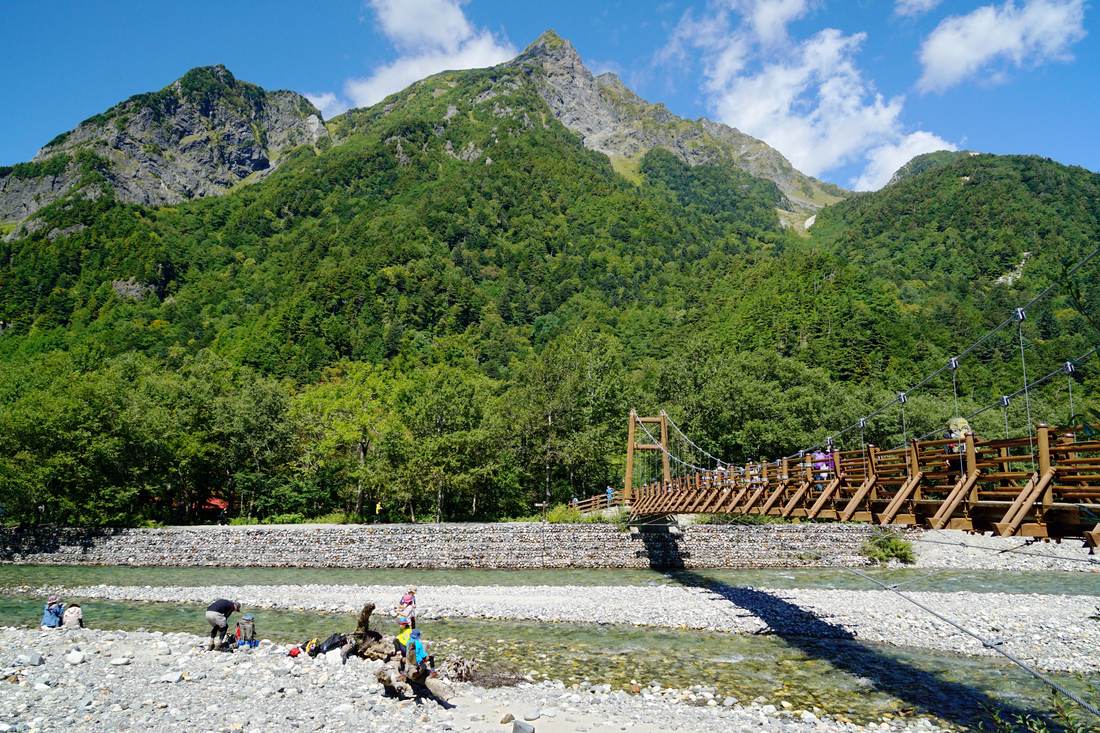 Myojin Bridge suspension bridge across the Azusa River with Mount Myojin rising behind it
