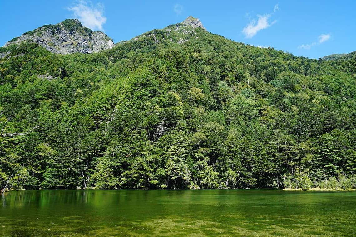 The clear, tranquil Myojin Pond in Kamikochi