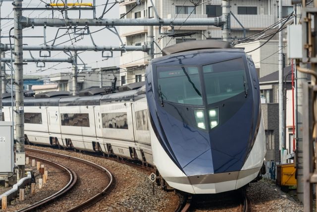Keisei Skyliner streamlined silver bullet-train livery at Narita Airport platform