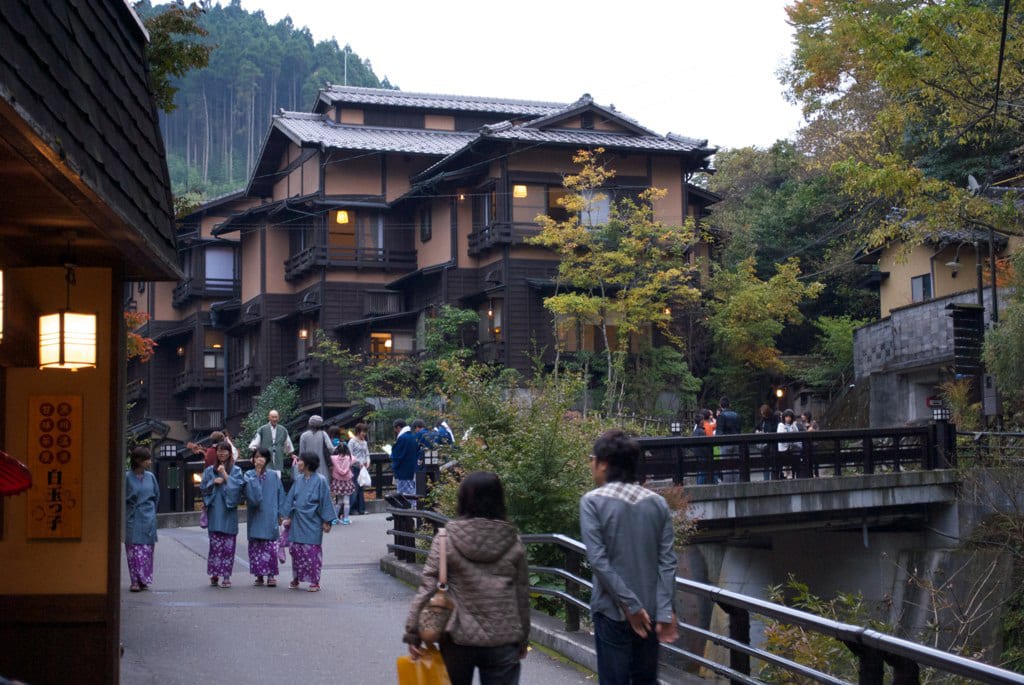 Wooden ryokan and the onsen town of Kurokawa along a river valley