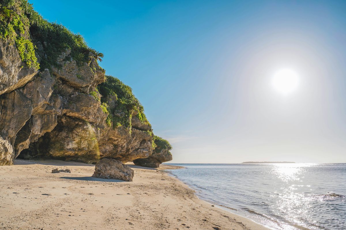 Cape Manzamo elephant-trunk rock formation with coral reef waters below