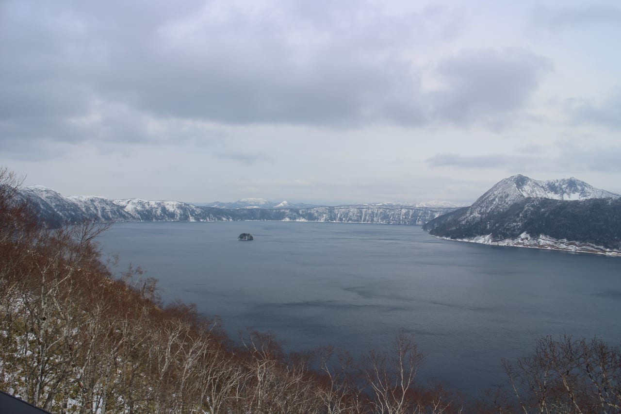 Deep-blue, ultra-clear Lake Mashu and its central island seen from the Mashu First Lookout