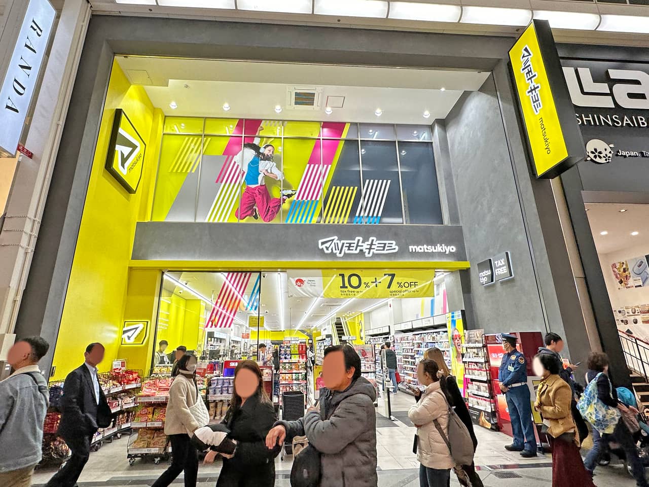 The yellow-and-blue sign of a Matsumoto Kiyoshi drugstore in Shinsaibashi, Osaka