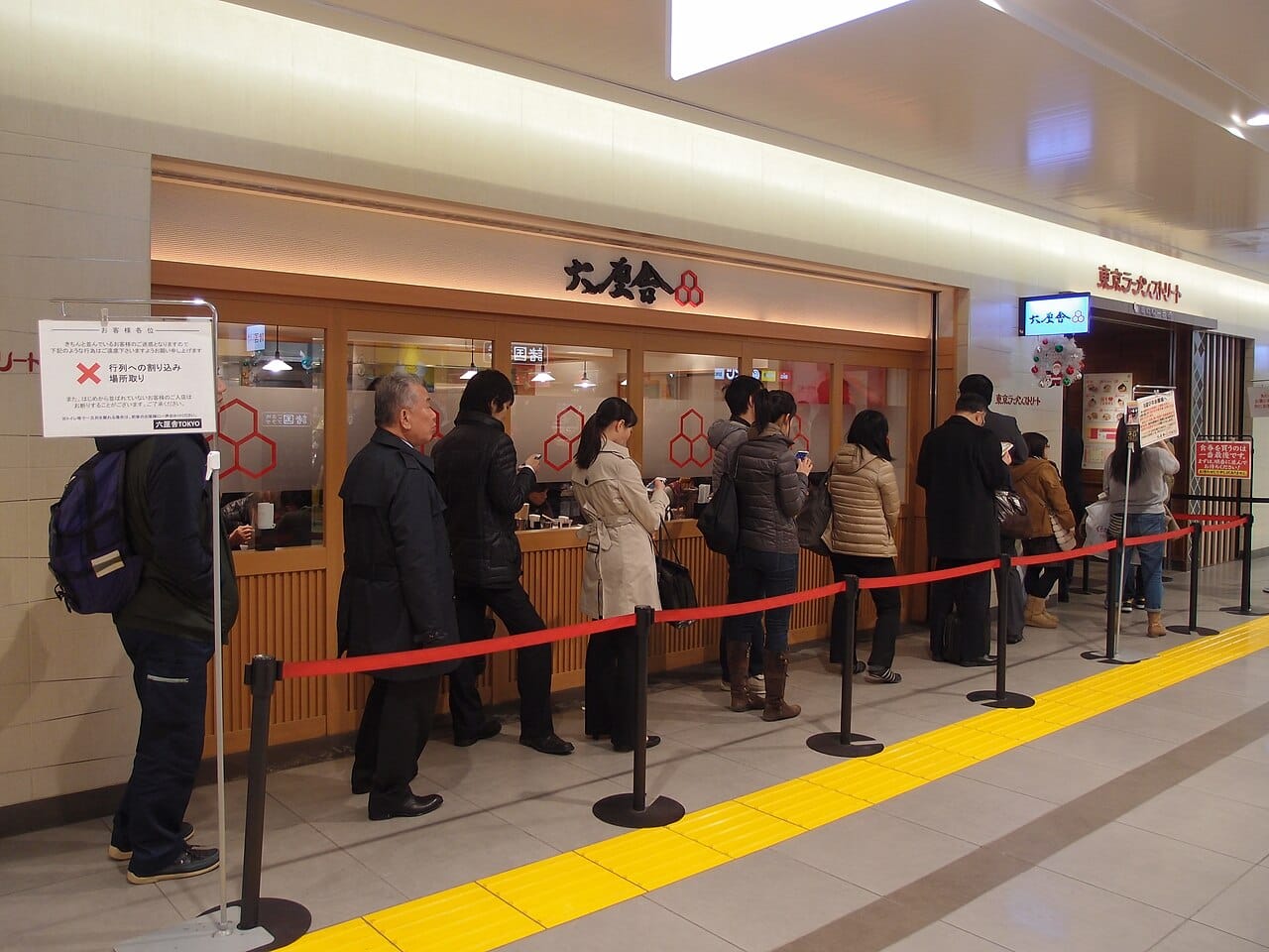 A queue outside a Tokyo ramen shop — places where locals line up are usually more authentic and better value than restaurants facing the sights