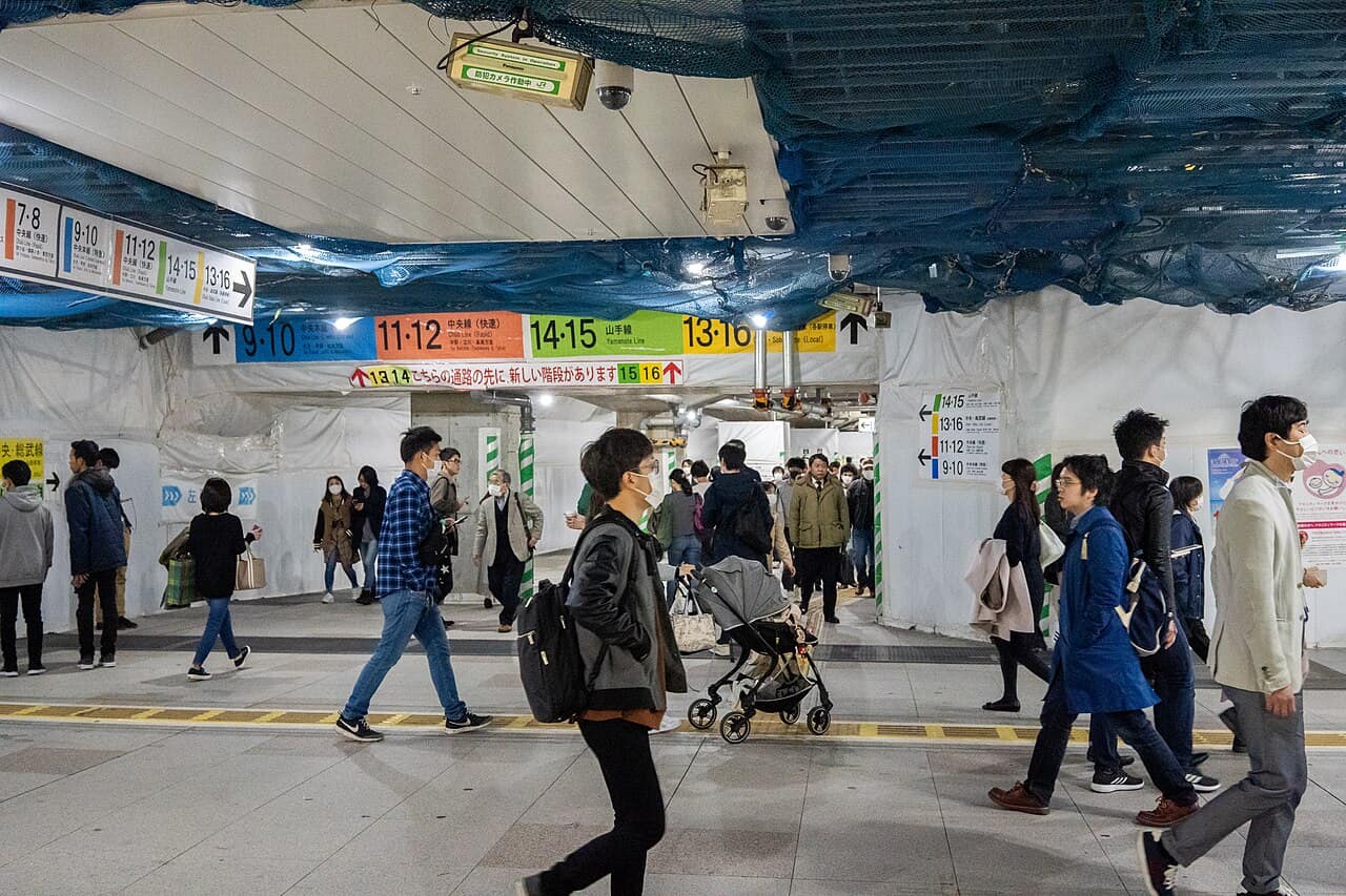 The crowded interior and layered passages of Shinjuku Station, where transfer walks are far longer than a map suggests