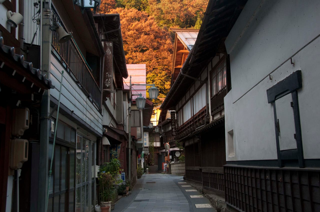 The cobblestone street of Shibu Onsen lined with wooden hot-spring ryokan