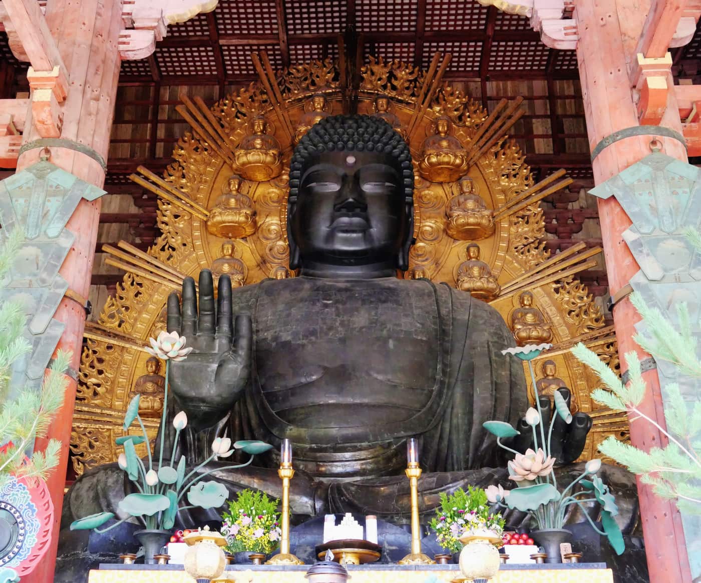 The bronze Great Buddha of Todaiji seated inside the Great Buddha Hall, with its golden halo of miniature Buddhas