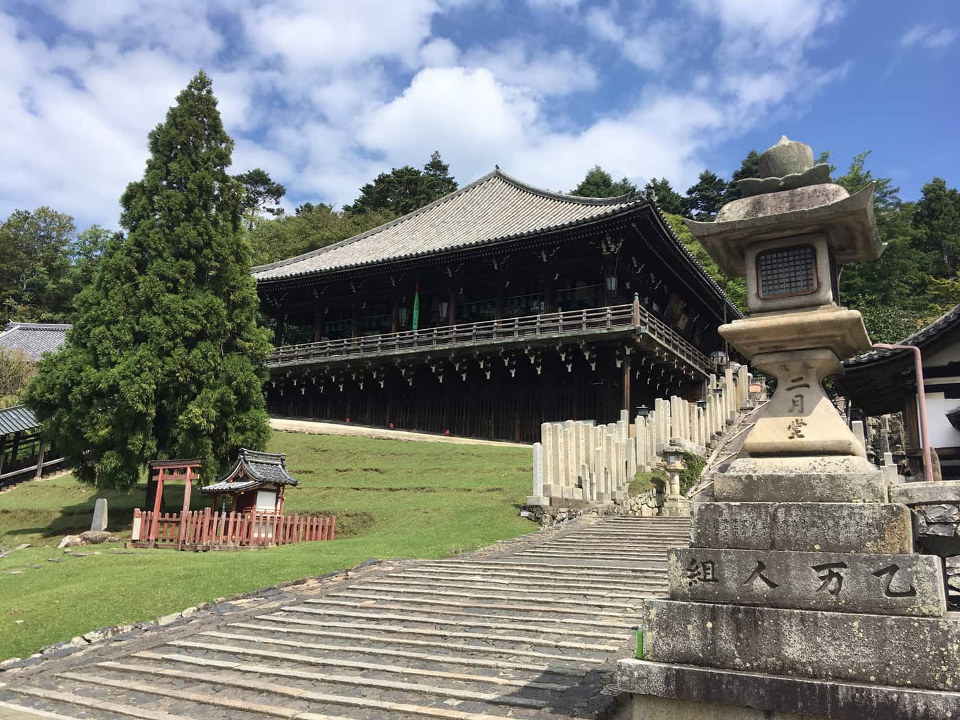 The stone stairway approach to Nigatsudo hall at Todaiji, with a stone lantern carved with the hall's name
