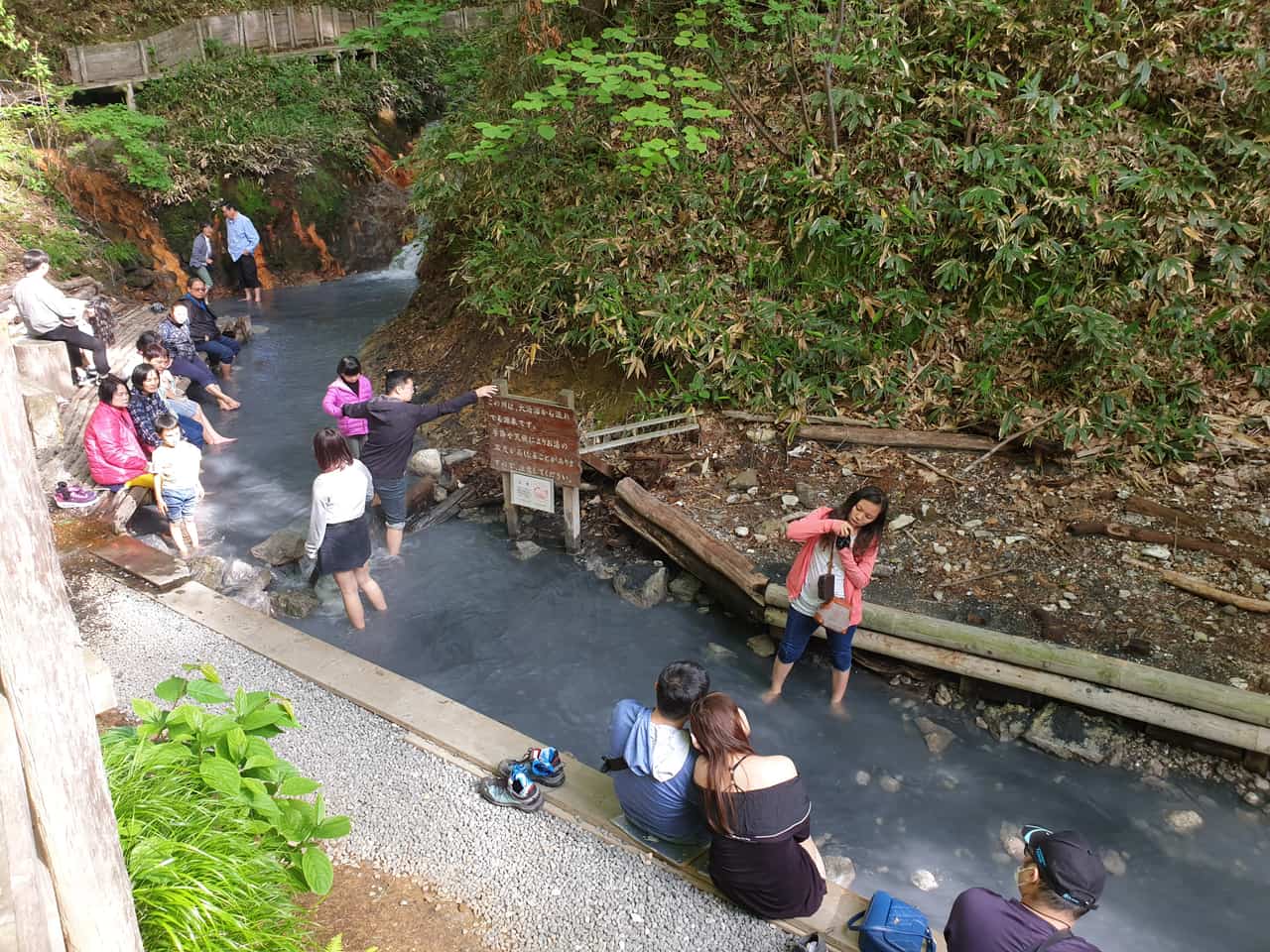 The Oyunuma River natural foot bath at Noboribetsu, a free sulfur stream beside a boardwalk