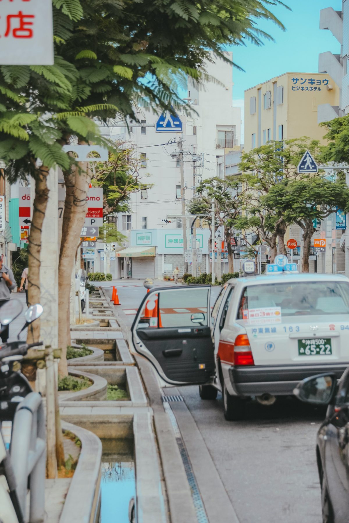 DFS T Galleria Okinawa rental car counter with agency signs and pickup area