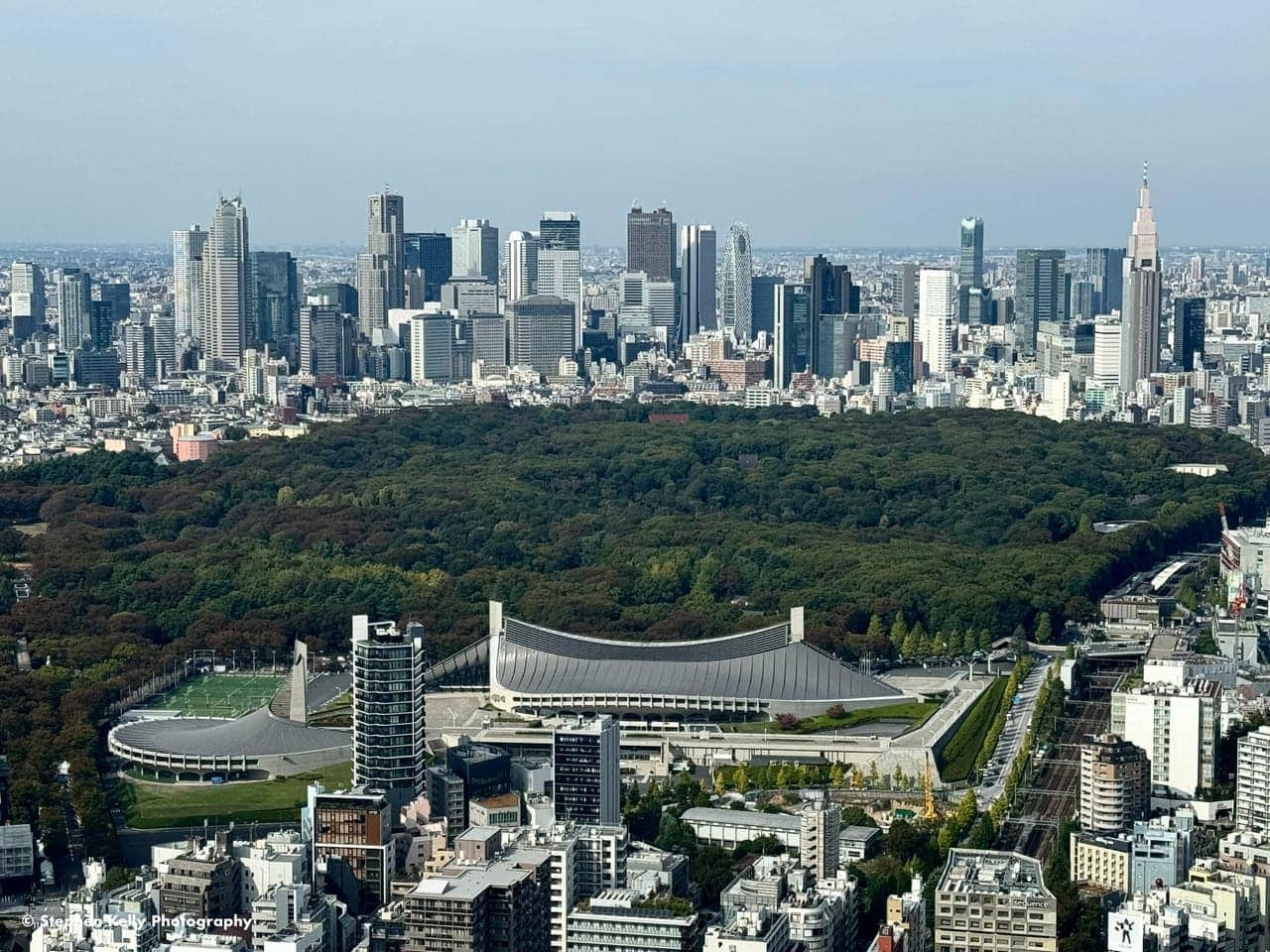The view from Shibuya Sky toward Yoyogi Park and the Shinjuku skyline