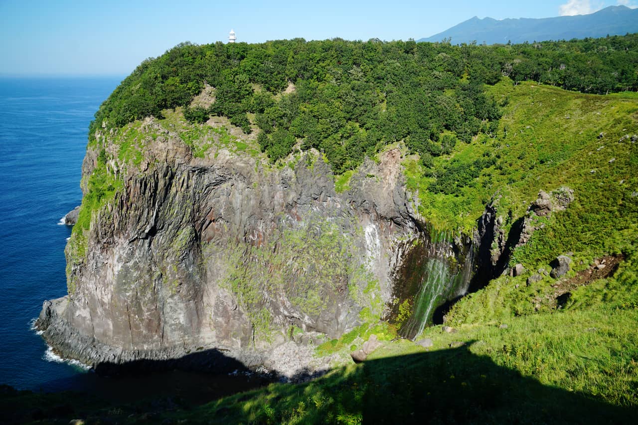 Furepe Falls seeping from a grassland cliff into the sea, one of the Shiretoko Eight Views