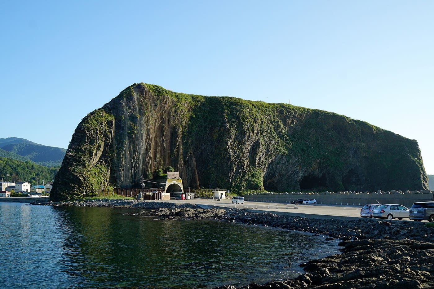 Utoro port with the green-topped Oronko Rock rising over the harbour