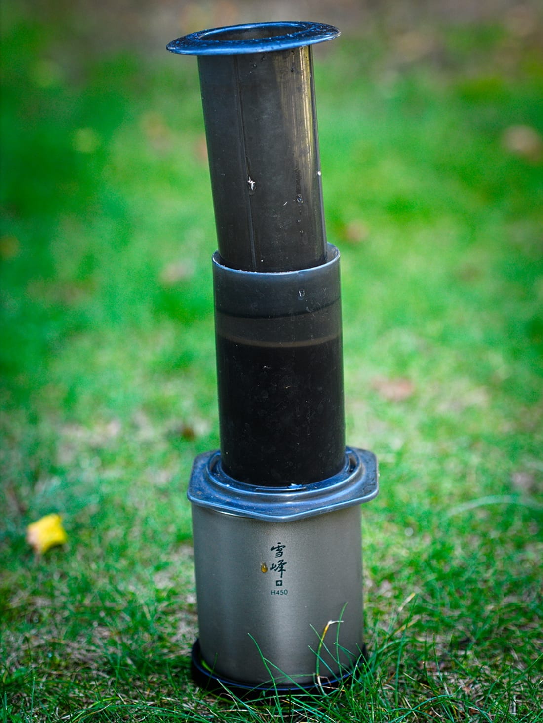 A Snow Peak double-wall titanium mug, the brand's signature item