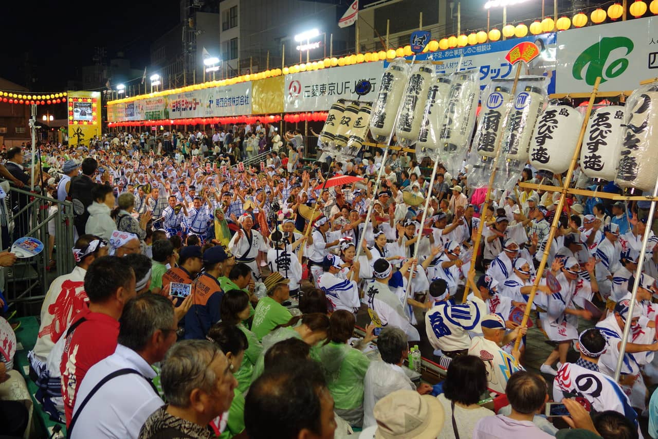 Dancers in troupes parading the streets at the Awa Odori festival in Tokushima City