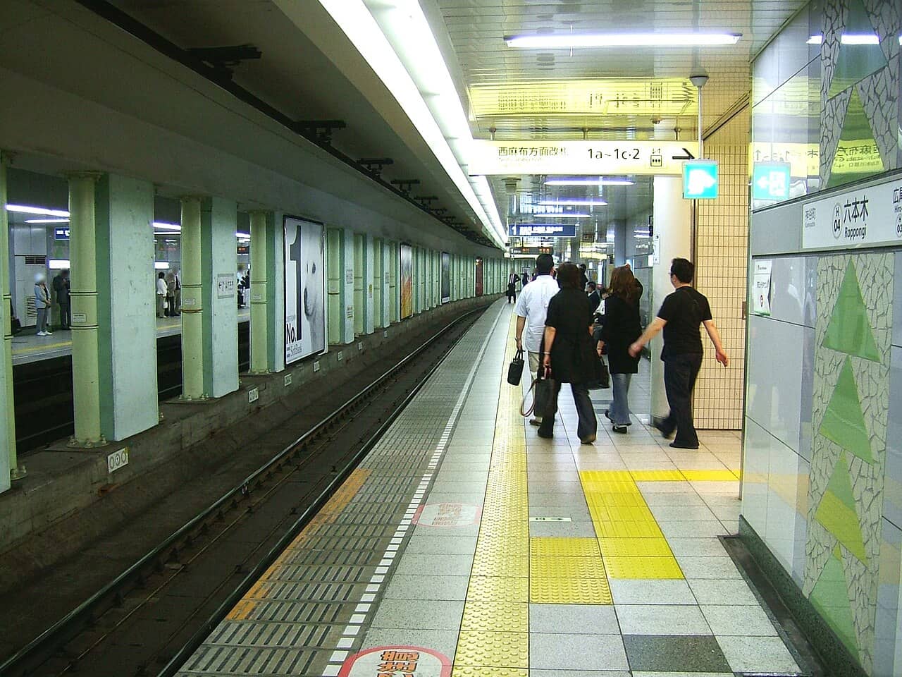 Tokyo Metro platform and train at Roppongi Station — the densest central subway coverage, reaching the back-street attractions JR can't