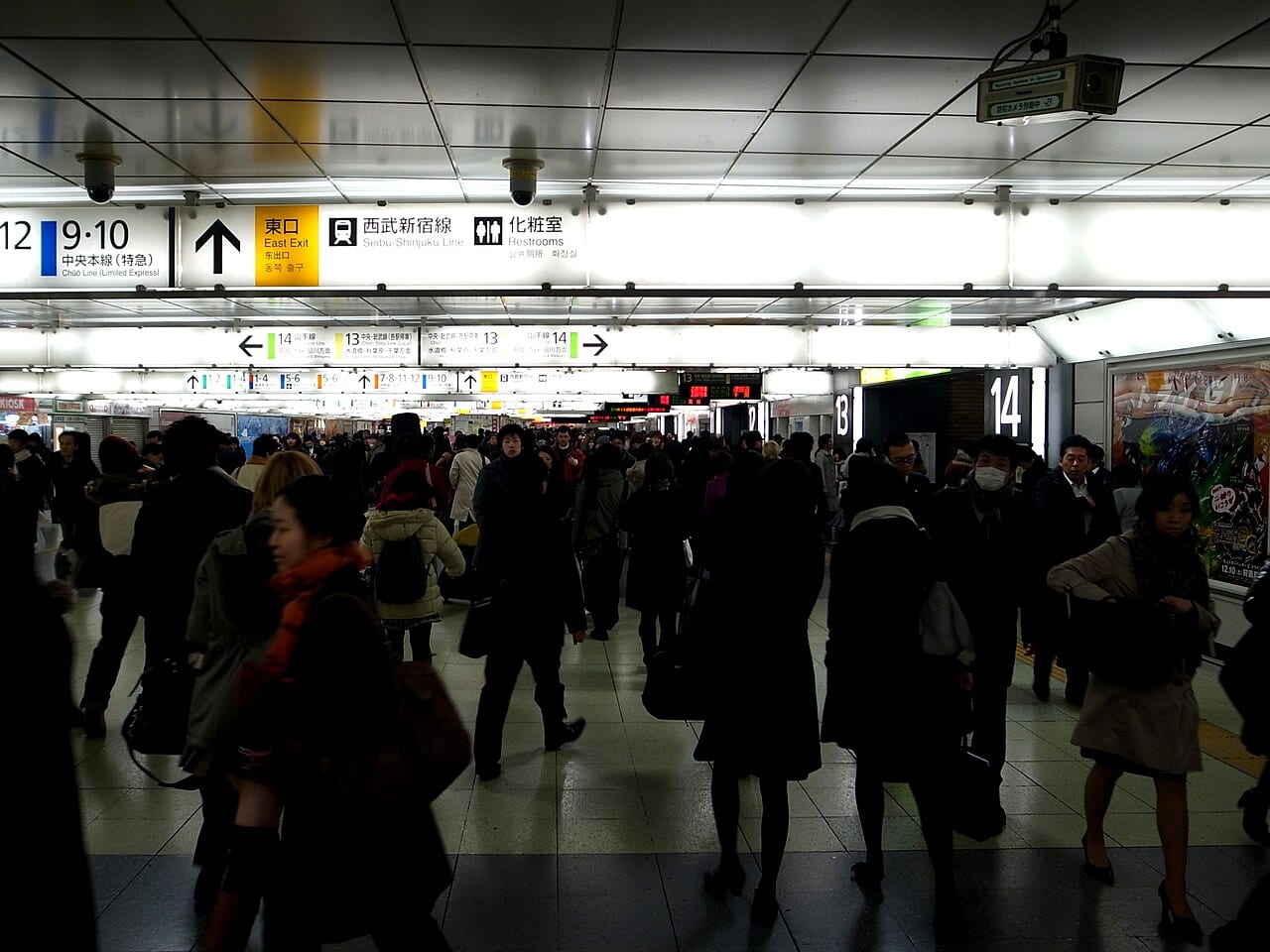 Shinjuku Station concourse crowds — Tokyo's busiest interchange, where the trick is to follow Google Maps' numbered exit rather than read the map