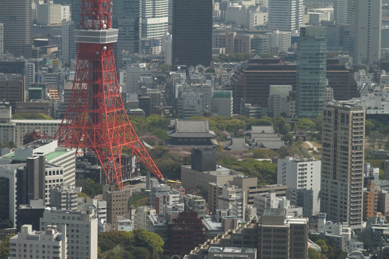 Tokyo Tower photographed from in front of Zojoji temple, red tower beside the temple