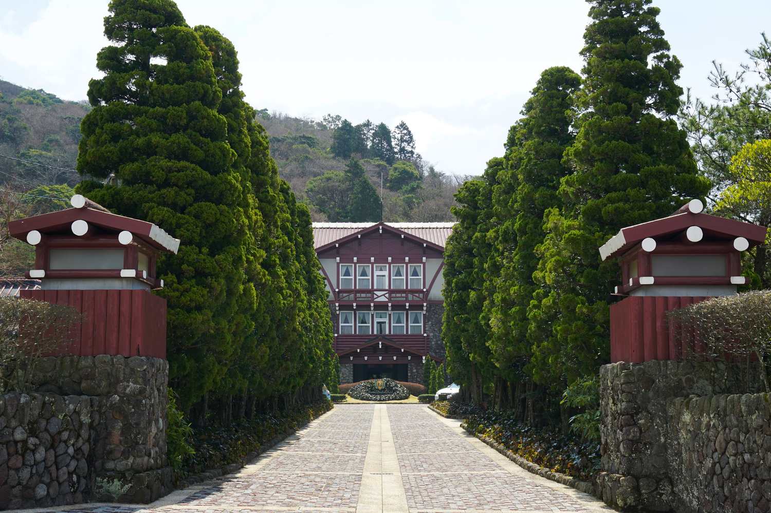 The forest approach and entrance to Unzen Kanko Hotel, a resort inn embraced by greenery