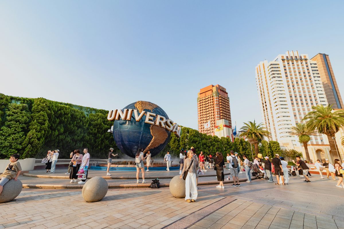 Universal Studios Japan entrance gate: the iconic globe and excited visitors