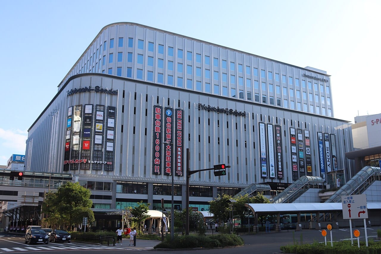 Vertical TAX FREE SHOP banner on the exterior of Yodobashi Sendai